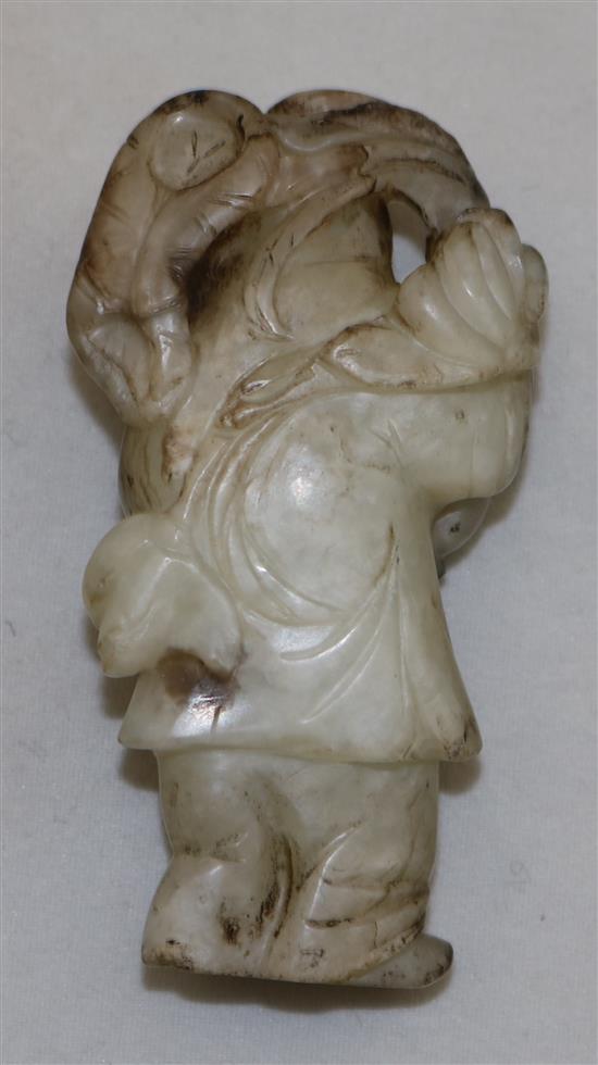 A Chinese white and black jade figure of a boy, 18th / 19th century, 5.8cm